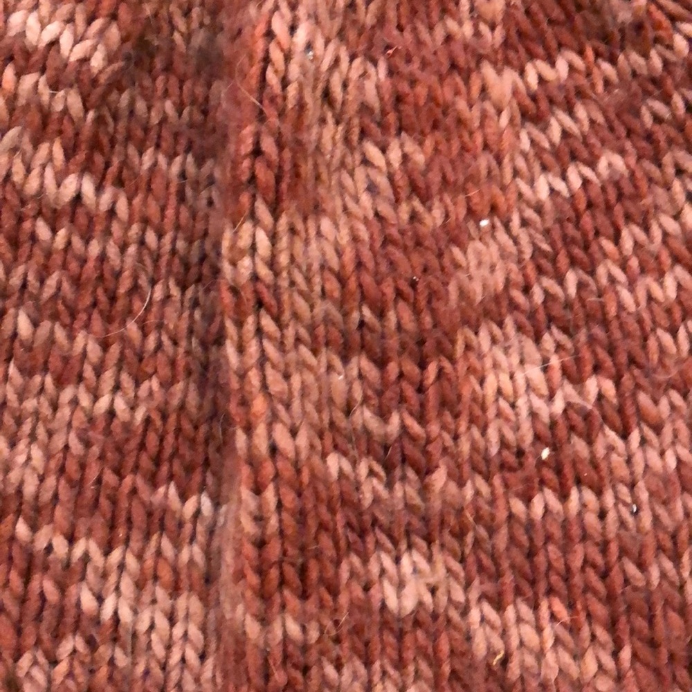 Burnt orange beanie with poofs